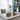 Moderne kantoorruimte met laptop, design bureaustoel, planten en stijlvolle decoraties.
