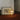 Cesta tafellamp, houten frame, glazen bol, sfeerverlichting, modern design, woonkamer decor.