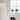 Hanglamp bolvormig wit modern design vensterbank planten minimalistisch interieur.