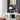 Chromen tafellamp met bolvormige kap op witte kast, moderne interieurdecoratie.