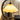 Moderne houten tafellamp met gebogen arm en beige stoffen kap, sfeerverlichting.