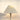 Witte tafellamp met geplooide kap en glazen voet, moderne verlichting, interieurdecoratie.
