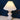Witte geplooide tafellamp, keramische basis, moderne verlichting, interieurdecoratie.