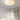 Witte plafondlamp in moderne slaapkamer, stoffen kap, minimalistisch design, sfeerverlichting.