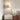 Witte moderne wandlamp in slaapkamer, minimalistisch design, sfeerverlichting, interieurdecoratie.
