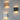 Drie moderne wandlampen, hout, zwart en wit, LED-verlichting, minimalistisch design.