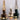 Drie vintage olielampen, bruin, wit en zwart, glazen kap, sfeerverlichting, retro design.