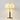 Witte stoffen tafellamp met bloemenpatroon, metalen voet, moderne interieurverlichting.