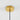Gouden plafondkap met zwarte kabel, moderne lampophanging, minimalistisch design.