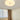 Moderne witte plafondlamp in slaapkamer, donutvormig design, energiezuinige verlichting.
