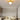 Gouden plafondlamp met moderne zonnestraalontwerp in een stijlvolle slaapkamer.