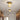 Gouden plafondlamp met glazen bol, moderne verlichting, hal, interieurdecoratie.