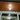 Moderne plafondlamp, houten lambrisering, LED-verlichting, interieurdesign, energiezuinig.