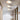 Witte plafondlampen met houten details in moderne hal, minimalistisch interieurontwerp.