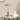 Gouden tafellamp met glazen kap op houten tafel, moderne verlichting, interieurdecoratie.