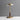 Gouden tafellamp met glazen kap en houten details, modern design, sfeerverlichting.