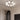 Moderne plafondlamp met witte glazen bollen, zwart frame, geschikt voor woonkamerverlichting.