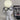 Witte hars robot tafellamp met bril naast laptop, modern design, sfeerverlichting.