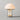 Moderne tafellamp met glazen kap en metalen basis, energiezuinige verlichting, eigentijds design.