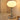 Moderne tafellamp met chromen bolvormige voet en witte glazen kap, sfeerverlichting, interieur.