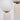 Moderne tafellamp met witte glazen bol en beige keramische voet, minimalistisch design.