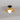 Rieten plafondlamp met zwarte basis en ronde witte bol, moderne verlichting.