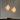 Twee glazen hanglampen met messing details, art deco stijl, warme verlichting, modern interieur.