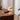 Valencia tafellamp, beige, modern design, houten bureau, sfeerverlichting, woonkamer decor.