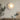 Moderne ronde wandlamp, wit, LED-verlichting, minimalistisch design, woonkamerdecor.