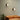 Twee moderne wandlampen op groene muur boven beige bank, interieurverlichting design.