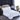 Luxe wit beddengoed set op tweepersoonsbed met beige hoofdbord in moderne slaapkamer.