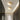Twee ovale albasten plafondlampen met gouden details in moderne gang.