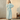 Vrouw in lichtblauwe fleece badjas met ceintuur, comfortabele loungewear, winterkleding.