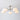 Moderne plafondlamp met vijf witte glazen kappen en metalen armatuur, eigentijds design.