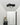 Zwarte Chio wandlamp in moderne hal, plafondmontage, eigentijds design, energiezuinige verlichting.