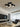 Zwarte Chio wandlamp in moderne woonkamer, plafondverlichting, eigentijds design.