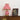 Rood-witte gestreepte tafellamp, retro design, op houten kast met gouden bloemenkunst.
