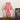 Rood-witte gestreepte tafellamp, circusstijl, glazen kap, houten tafel, decoratieve verlichting.