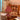 Rood-witte gestreepte tafellamp in retrostijl op houten tafel in gezellige woonkamer.