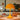 Gele tafellamp, modern design, kunststof, sfeerverlichting, eettafel, interieurdecoratie.