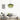 Groene glazen hanglamp boven moderne grijze bank in minimalistisch interieur.
