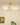 Gouden glazen plafondlamp met bloemmotief, elegante verlichting, vintage stijl, woonkamer decor.