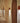 Wandlampen in hal, modern design, roestkleur, boogvormige deuropeningen, sfeerverlichting.