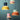 Vier Nordic macaron-stijl hanglampen in pastelkleuren tegen een groene achtergrond.