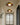 Moderne plafondlamp met houten afwerking en LED-verlichting in hal interieur.