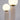 Moderne tafellamp met twee witte glazen bollen en beige keramische basis, minimalistisch design.