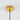 Gouden plafondkap met zwarte kabel, moderne lampophanging, minimalistisch design.