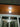 Moderne plafondlamp, houten lambrisering, LED-verlichting, interieurdesign, energiezuinig.