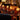 Luxe restaurantinterieur met tafellampen, glazen en lederen stoelen, warme sfeer.