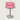 Roze glazen tafellamp met chromen standaard, modern design, sfeerverlichting, interieurdecoratie.